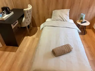 Un ou plusieurs lits dans un hébergement de l'établissement Hôtel Le Normandie