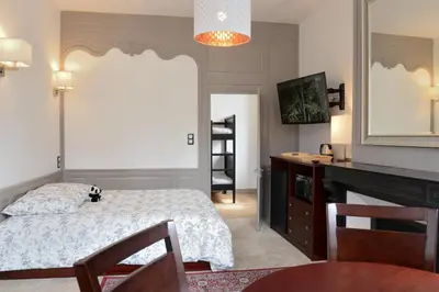 Un ou plusieurs lits dans un hébergement de l'établissement Maison du chatelain