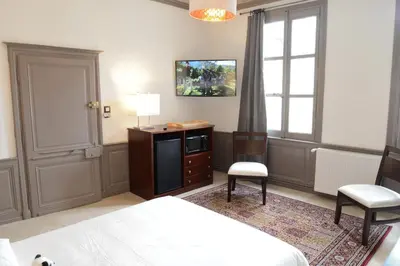 Un ou plusieurs lits dans un hébergement de l'établissement Maison du chatelain