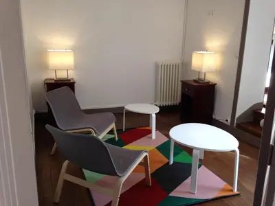 Coin salon dans l'établissement Maison du chatelain