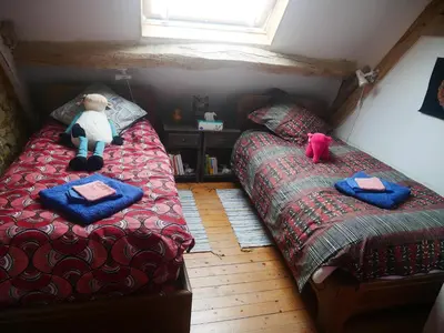 Un ou plusieurs lits dans un hébergement de l'établissement Au Coeur de la Cour