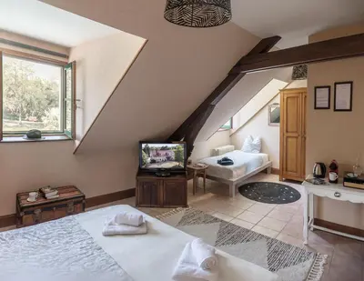 Un ou plusieurs lits dans un hébergement de l'établissement Les Aulnaies - B&B