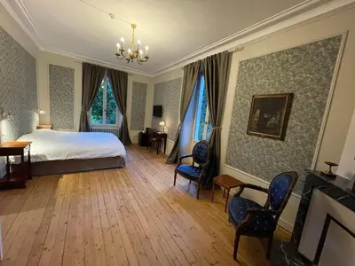 Un ou plusieurs lits dans un hébergement de l'établissement Château De La Coutancière