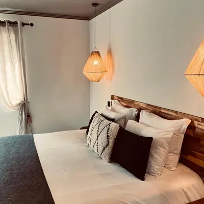 Un ou plusieurs lits dans un hébergement de l'établissement Hôtel Rive Sud