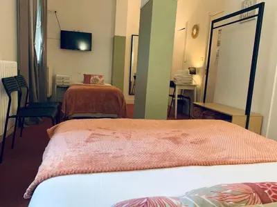 Un ou plusieurs lits dans un hébergement de l'établissement Hôtel Trianon Tours