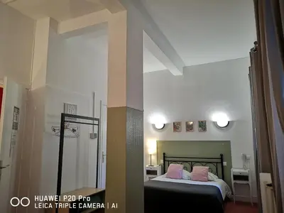 Un ou plusieurs lits dans un hébergement de l'établissement Hôtel Trianon Tours