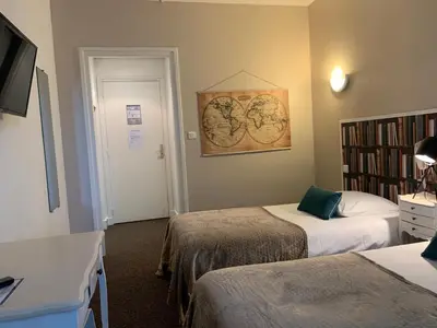 Un ou plusieurs lits dans un hébergement de l'établissement Hôtel Trianon Tours