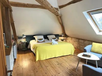 Un ou plusieurs lits dans un hébergement de l'établissement Aquarelle