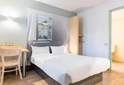 Un ou plusieurs lits dans un hébergement de l'établissement B&B HOTEL Tours Nord 1 Val de Loire