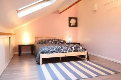 Un ou plusieurs lits dans un hébergement de l'établissement La Maison Tourangelle