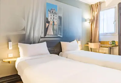 Un ou plusieurs lits dans un hébergement de l'établissement B&B HOTEL TOURS Sud Joué-lès-Tours