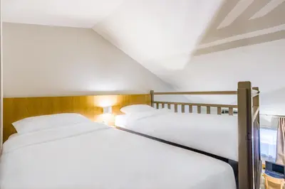 Un ou plusieurs lits dans un hébergement de l'établissement B&B HOTEL TOURS Sud Joué-lès-Tours