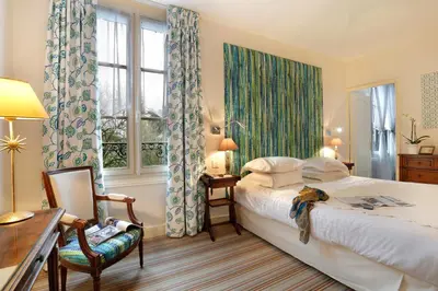 Un ou plusieurs lits dans un hébergement de l'établissement Auberge du Bon Laboureur Chenonceaux