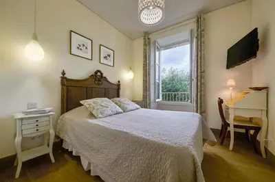 Un ou plusieurs lits dans un hébergement de l'établissement Hôtel Diderot