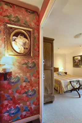Un ou plusieurs lits dans un hébergement de l'établissement Hôtel Diderot