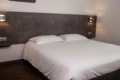 Un ou plusieurs lits dans un hébergement de l'établissement H24 HOTEL