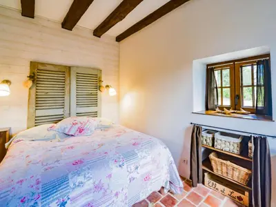 Un ou plusieurs lits dans un hébergement de l'établissement Holiday Home Le Pigeonnier by Interhome
