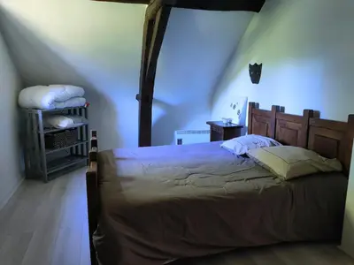 Un ou plusieurs lits dans un hébergement de l'établissement Chambres dans le gîte 