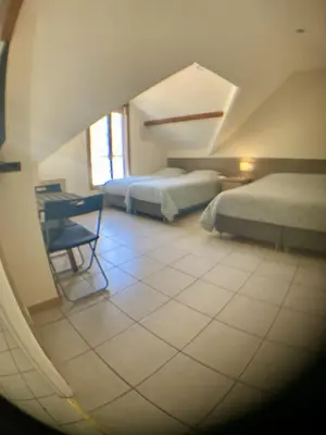Un ou plusieurs lits dans un hébergement de l'établissement Beauval Chambre