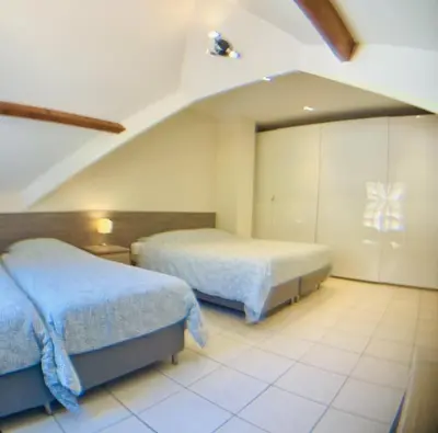Un ou plusieurs lits dans un hébergement de l'établissement Beauval Chambre