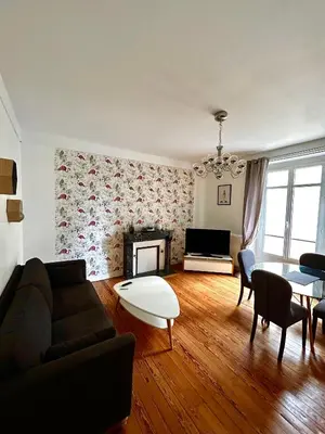 Coin salon dans l'établissement Appartements Plantagenet - Le 27