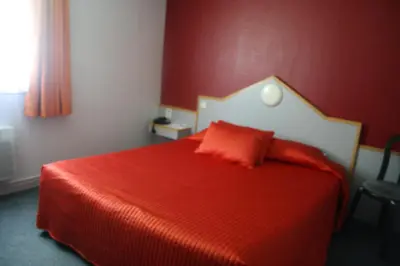 Un ou plusieurs lits dans un hébergement de l'établissement Fasthotel Vendome