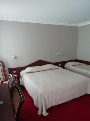 Un ou plusieurs lits dans un hébergement de l'établissement Hôtel Du Manoir