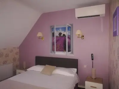 Un ou plusieurs lits dans un hébergement de l'établissement Contact Hôtel du Relais Thouars