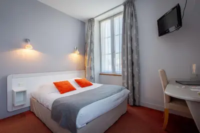 Un ou plusieurs lits dans un hébergement de l'établissement Hôtel Miléade Le Domaine de la Blairie - Saumur