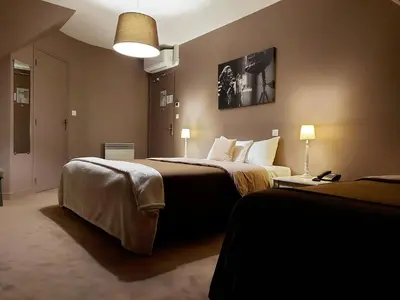 Un ou plusieurs lits dans un hébergement de l'établissement Hotel Mondial