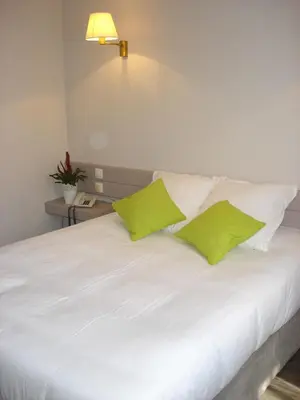 Un ou plusieurs lits dans un hébergement de l'établissement Hotel-Restaurant Du Lac