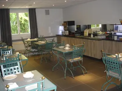 Restaurant ou autre lieu de restauration dans l'établissement Hotel-Restaurant Du Lac