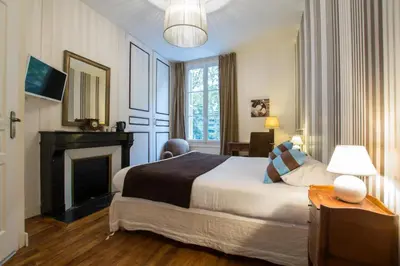 Un ou plusieurs lits dans un hébergement de l'établissement Hotel Val De Loire