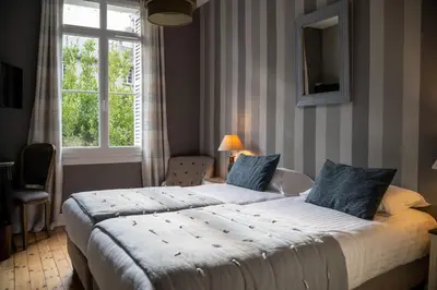 Un ou plusieurs lits dans un hébergement de l'établissement Hotel Val De Loire