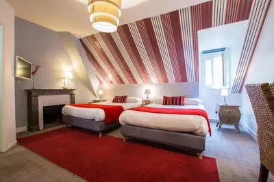 Un ou plusieurs lits dans un hébergement de l'établissement Hotel Val De Loire