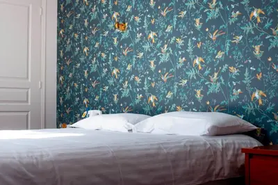 Un ou plusieurs lits dans un hébergement de l'établissement Logis Auberge Bienvenue