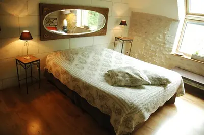 Un ou plusieurs lits dans un hébergement de l'établissement Les Pierres D'aurèle Chambres d'Hôtes