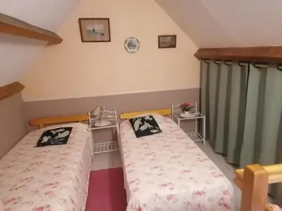 Un ou plusieurs lits dans un hébergement de l'établissement Le Clos des Roses