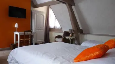 Un ou plusieurs lits dans un hébergement de l'établissement Logis Hôtels Restaurant Le Relais Chenonceaux