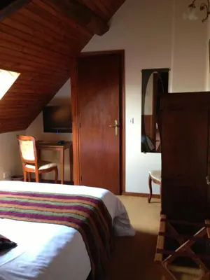 Un ou plusieurs lits dans un hébergement de l'établissement Logis Hôtels Restaurant Le Relais Chenonceaux