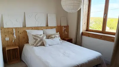 Un ou plusieurs lits dans un hébergement de l'établissement Maison ecologique en paille