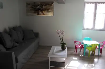Coin salon dans l'établissement Un petit coin de paradis