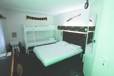 Un ou plusieurs lits dans un hébergement de l'établissement hôtel QUICK Palace Tours Nord