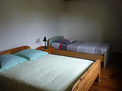 Un ou plusieurs lits dans un hébergement de l'établissement Gite Maison de campagne 86120-22 couchages
