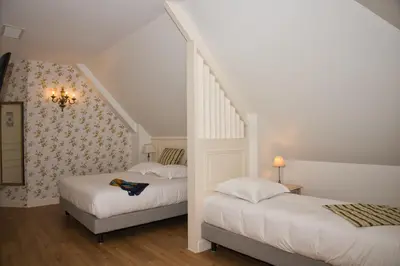 Un ou plusieurs lits dans un hébergement de l'établissement Chateau de la Rozelle