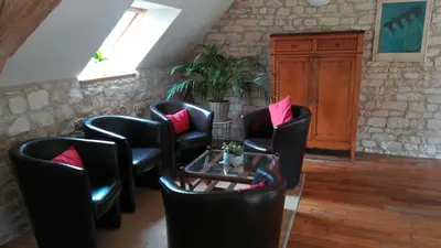 Coin salon dans l'établissement Gîte et chambres d'hôtes Le Chêne Billault