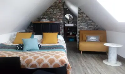 Coin salon dans l'établissement Hébergements indépendants chez l'habitant