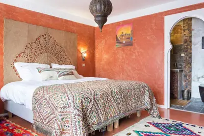 Un ou plusieurs lits dans un hébergement de l'établissement Riad SPA 