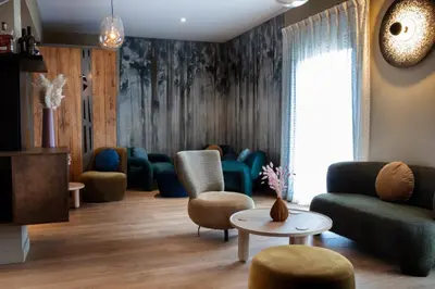 Coin salon dans l'établissement Auberge Pom'Poire