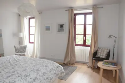 Un ou plusieurs lits dans un hébergement de l'établissement Gite La Maison Blanche Familiale Château La Roche Racan